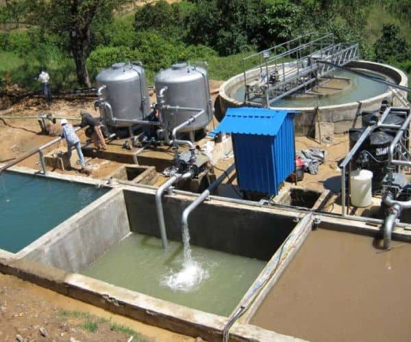 Effluent treatment plant with collection tanks, filters and treated water channel