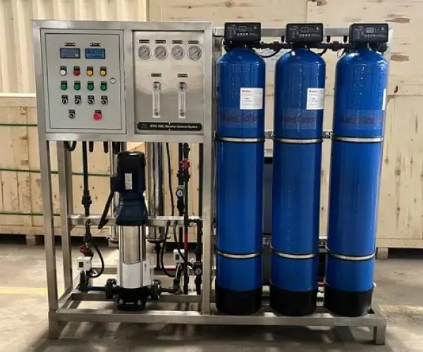 Skid-mounted reverse osmosis system with control panel and media filters